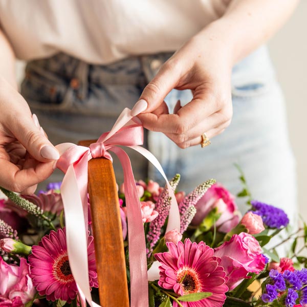 Pettitts Florists floral arrangement of pink and purple flowers